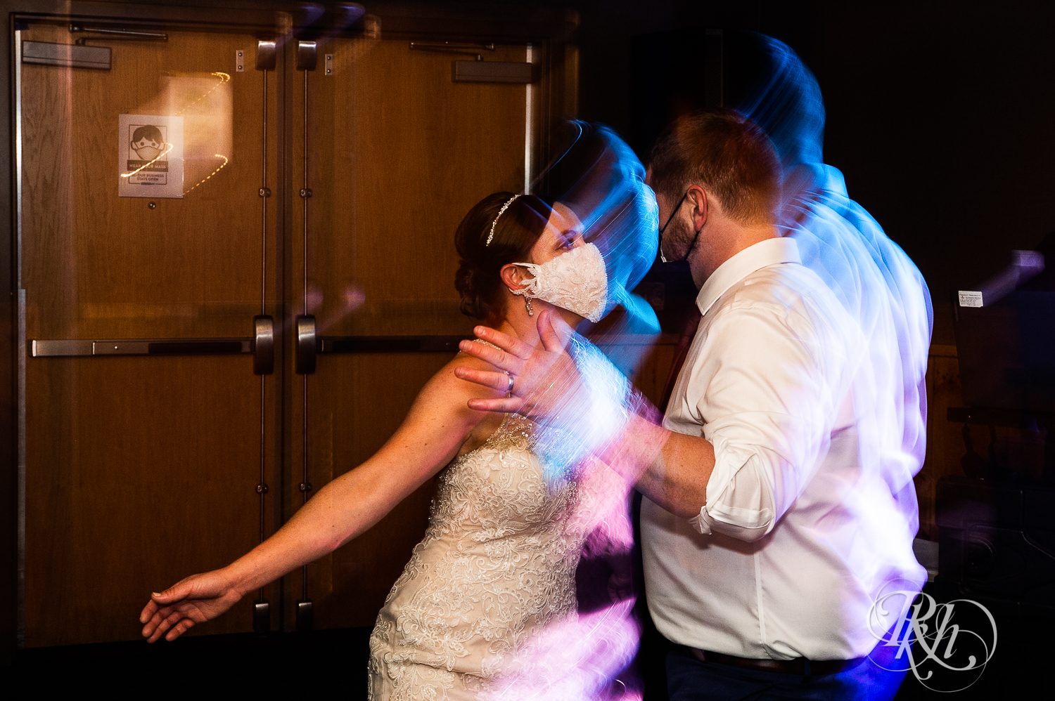 Guests dance with bride and groom at reception at Superior Shores Resort in Two Harbors, Minnesota.
