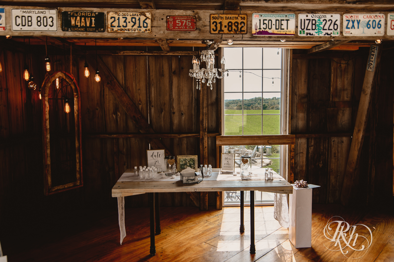 Tables and decor at barn wedding at Legacy Hills Farm in Welch, Minnesota.