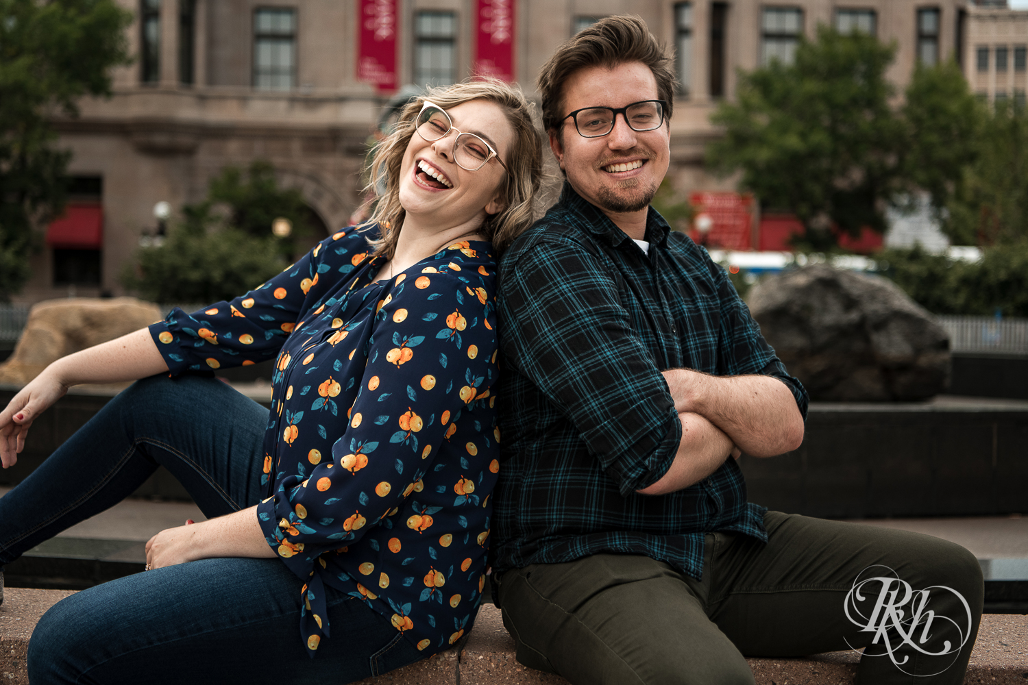 Blond woman with glasses and man with glasses laugh in Saint Paul, Minnesota.