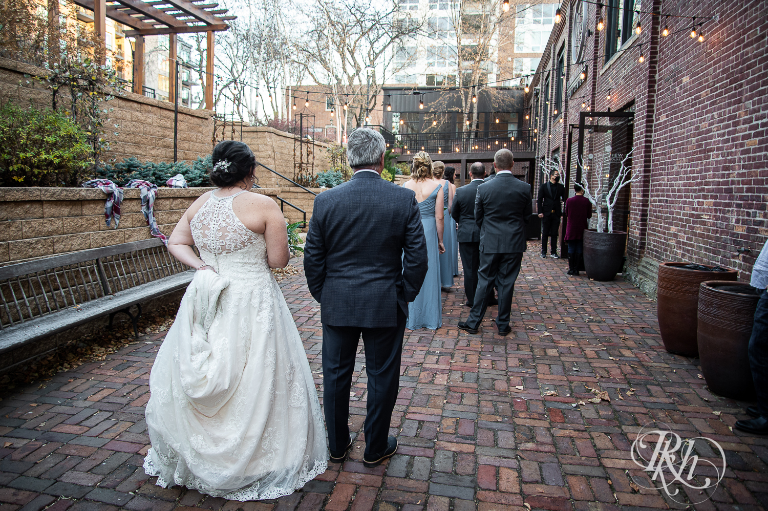 Bride walks down the aisle with dad at Minneapolis Event Centers in Minneapolis, Minnesota.