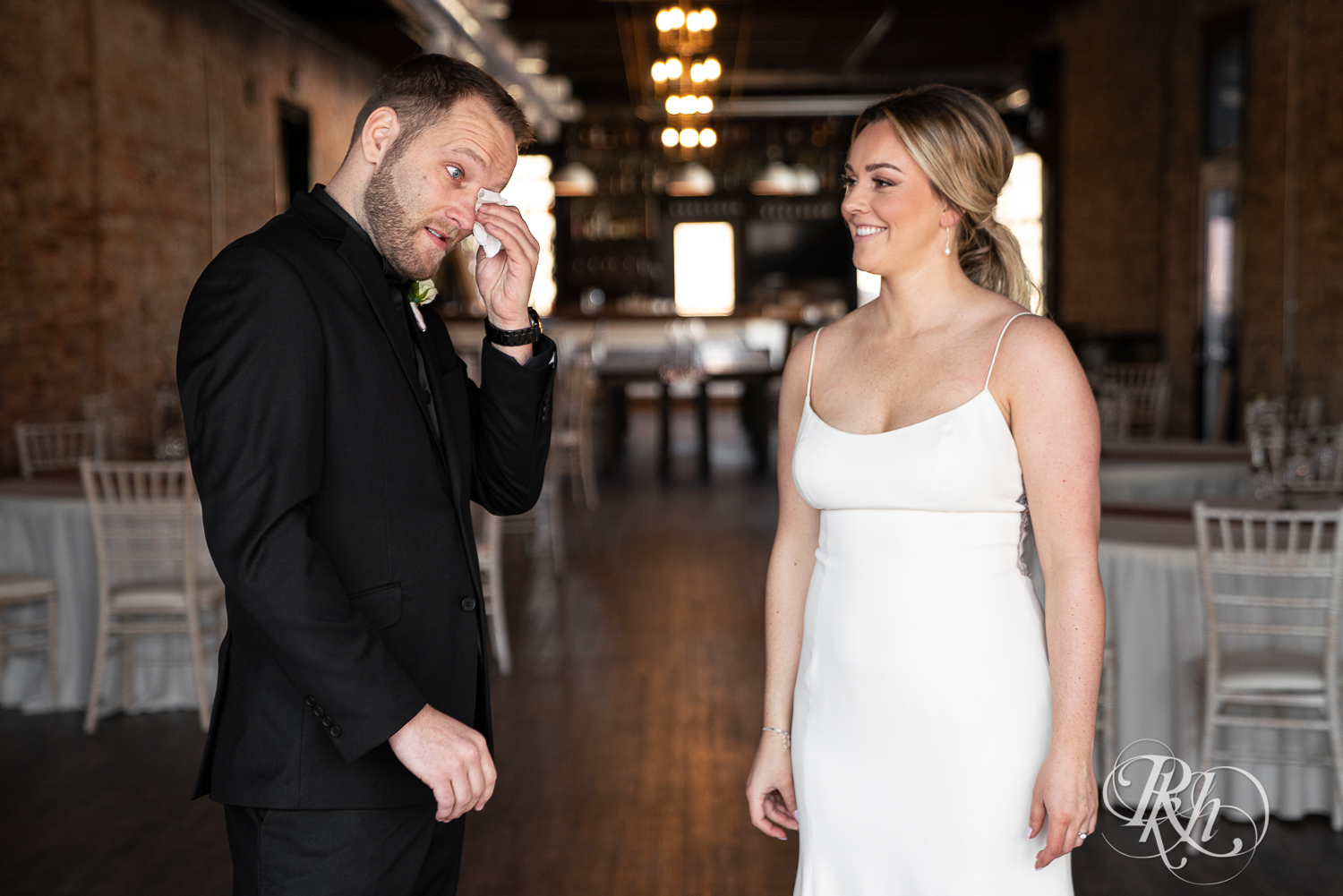 Groom cries during first look at the 3 Ten Event Center in Faribault, Minnesota.
