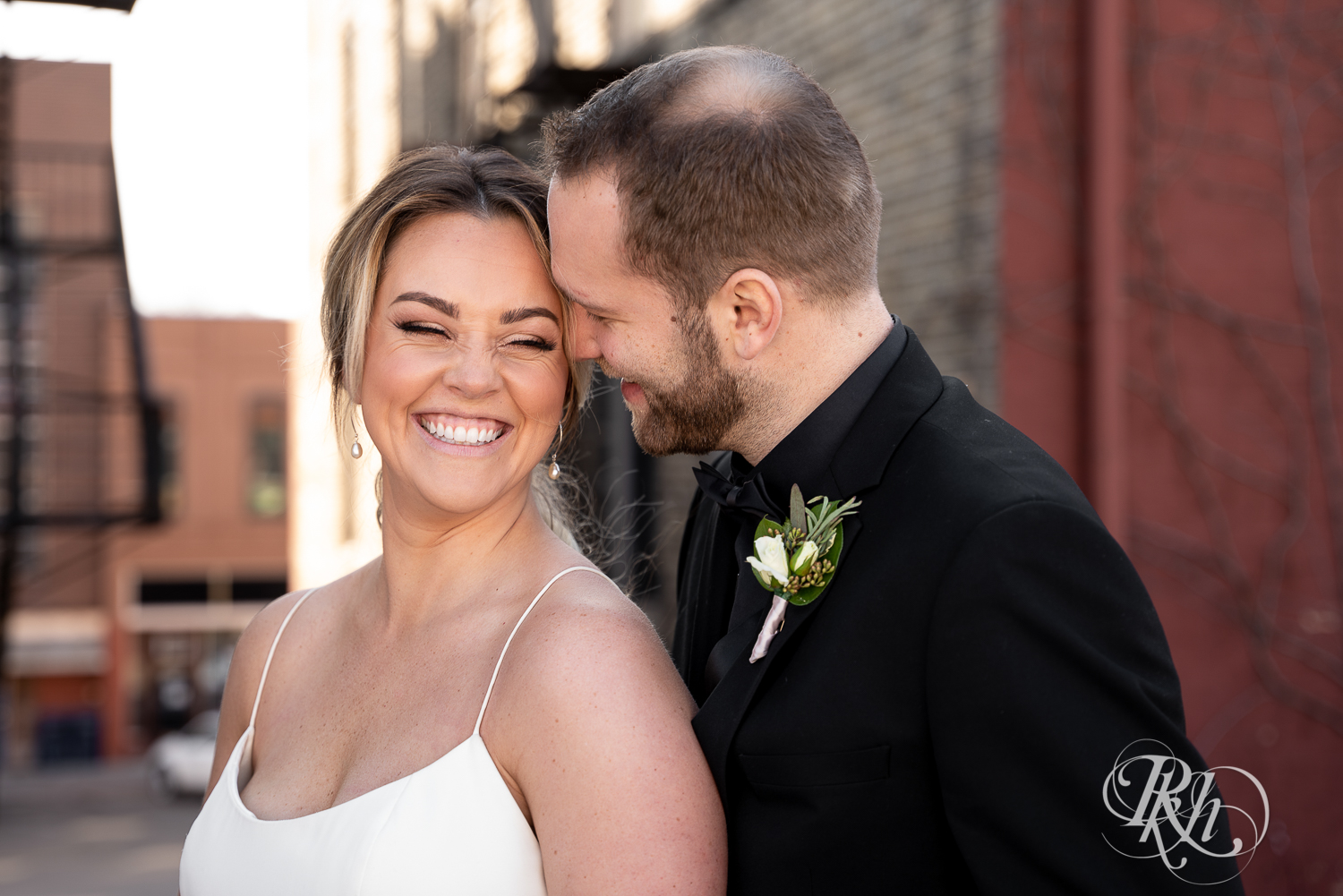Bride and groom kiss on the roof of the 3 Ten Event Center in Faribault, Minnesota.