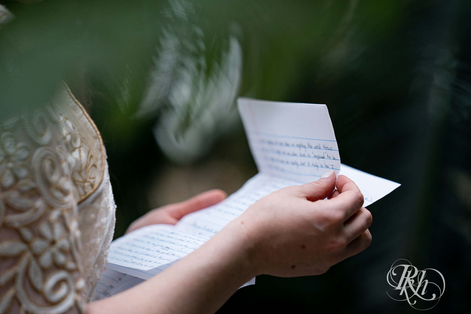 Bride reading vow at Indian wedding at Como Zoo Conservatory in Saint Paul, Minnesota.