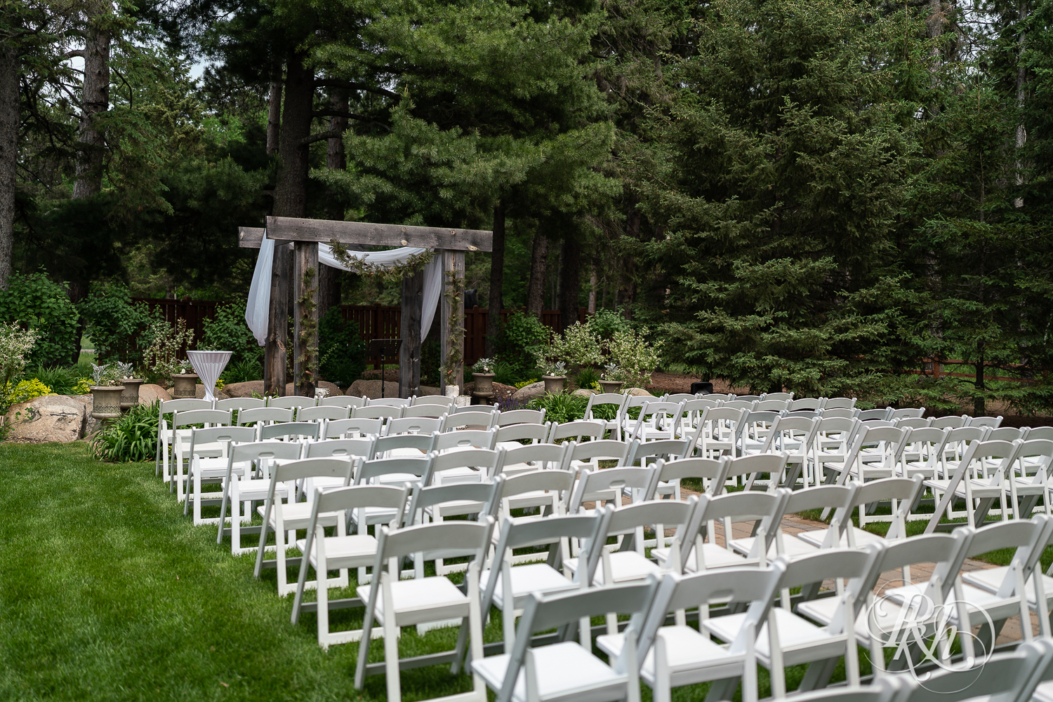 Sunny outdoor wedding ceremony setup at Pine Peaks Event Center in Pine River, Minnesota.