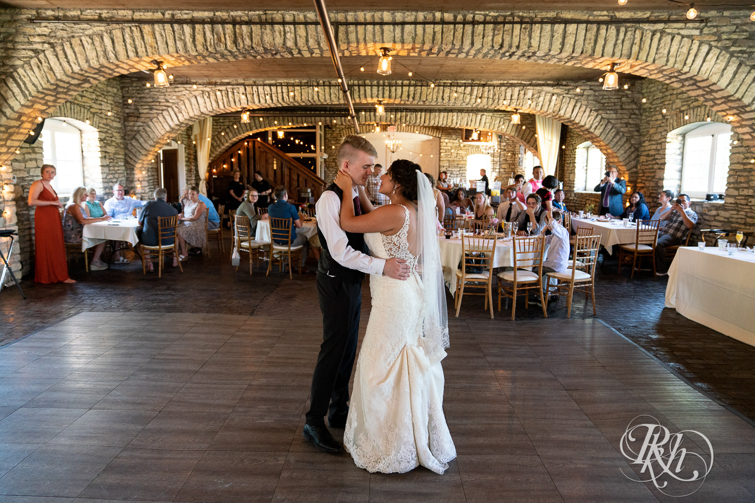 Bride and groom dancing at wedding reception at Mayowood Stone Barn in Rochester, Minnesota.