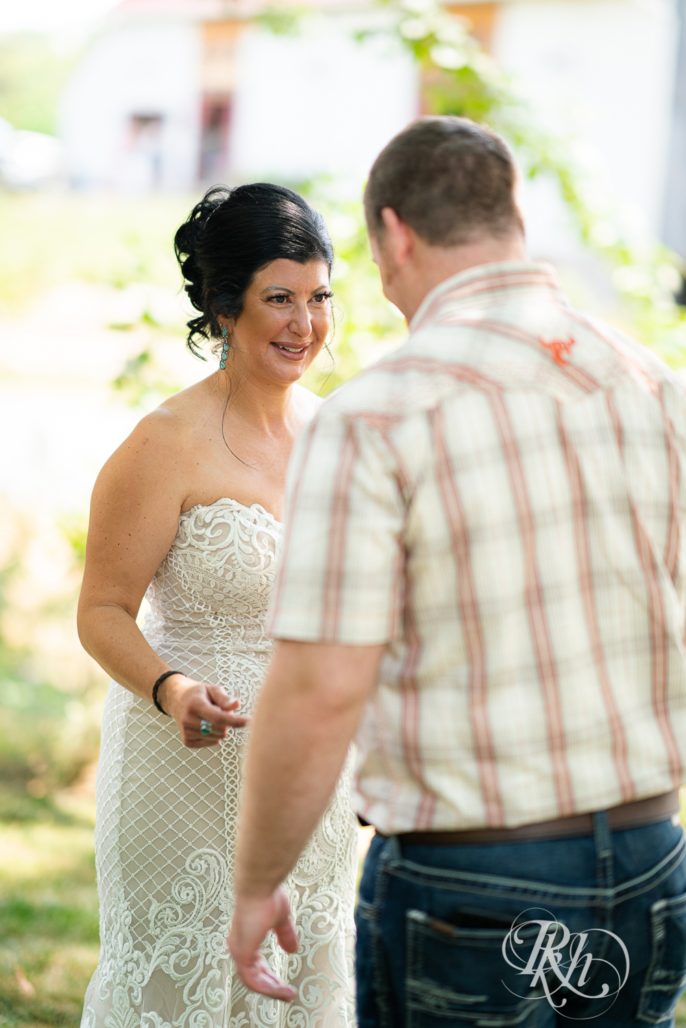 Bride and groom share first look at Croix View Farm in Osceola, Wisconsin.