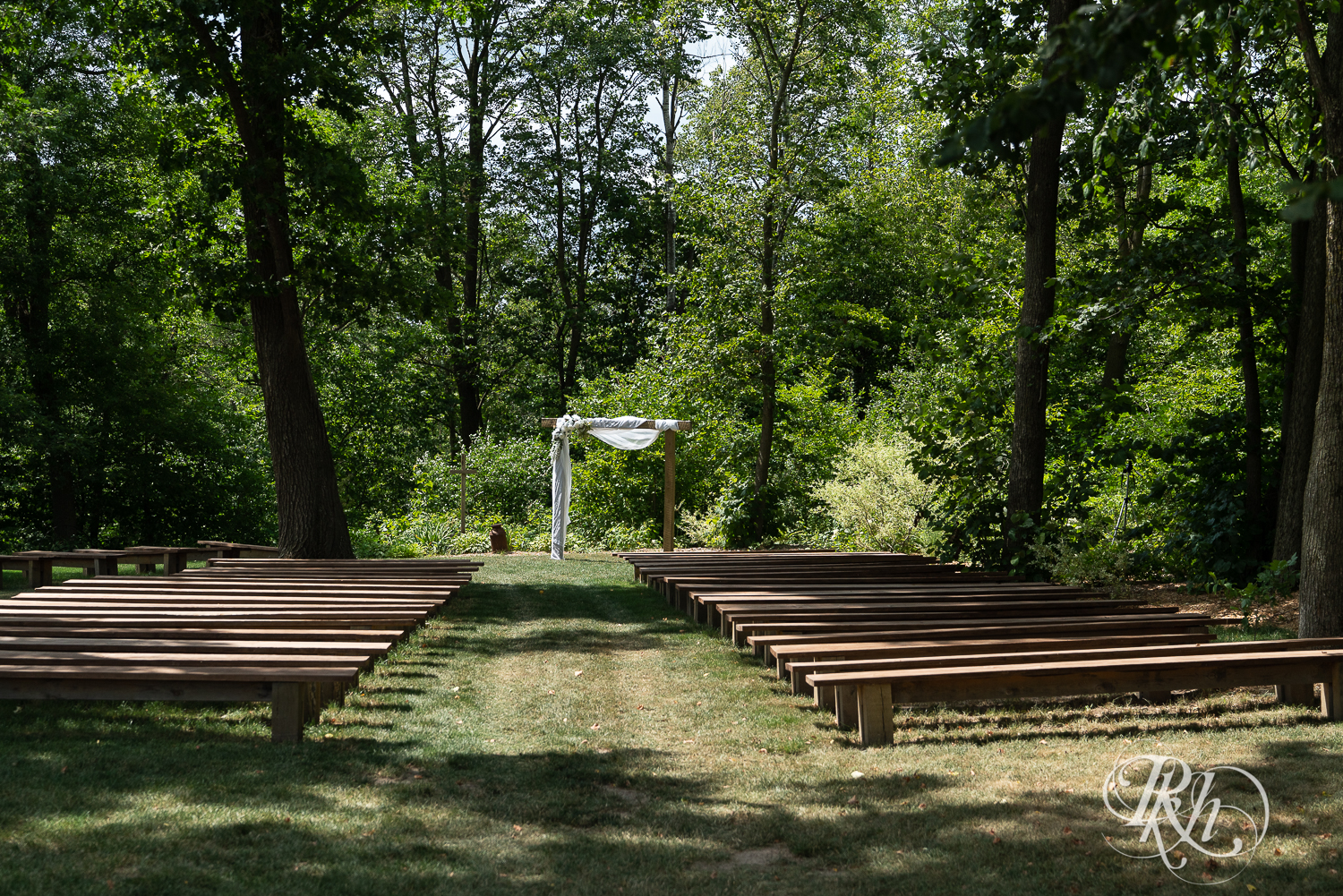 Outdoor country barn wedding ceremony setup at Croix View Farm in Osceola, Wisconsin.
