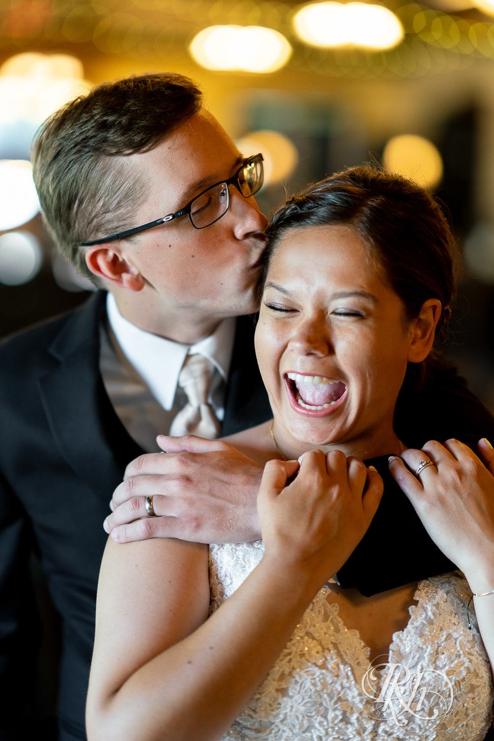 Bride and groom kiss at Kellerman's Event Center in White Bear Lake, Minnesota.
