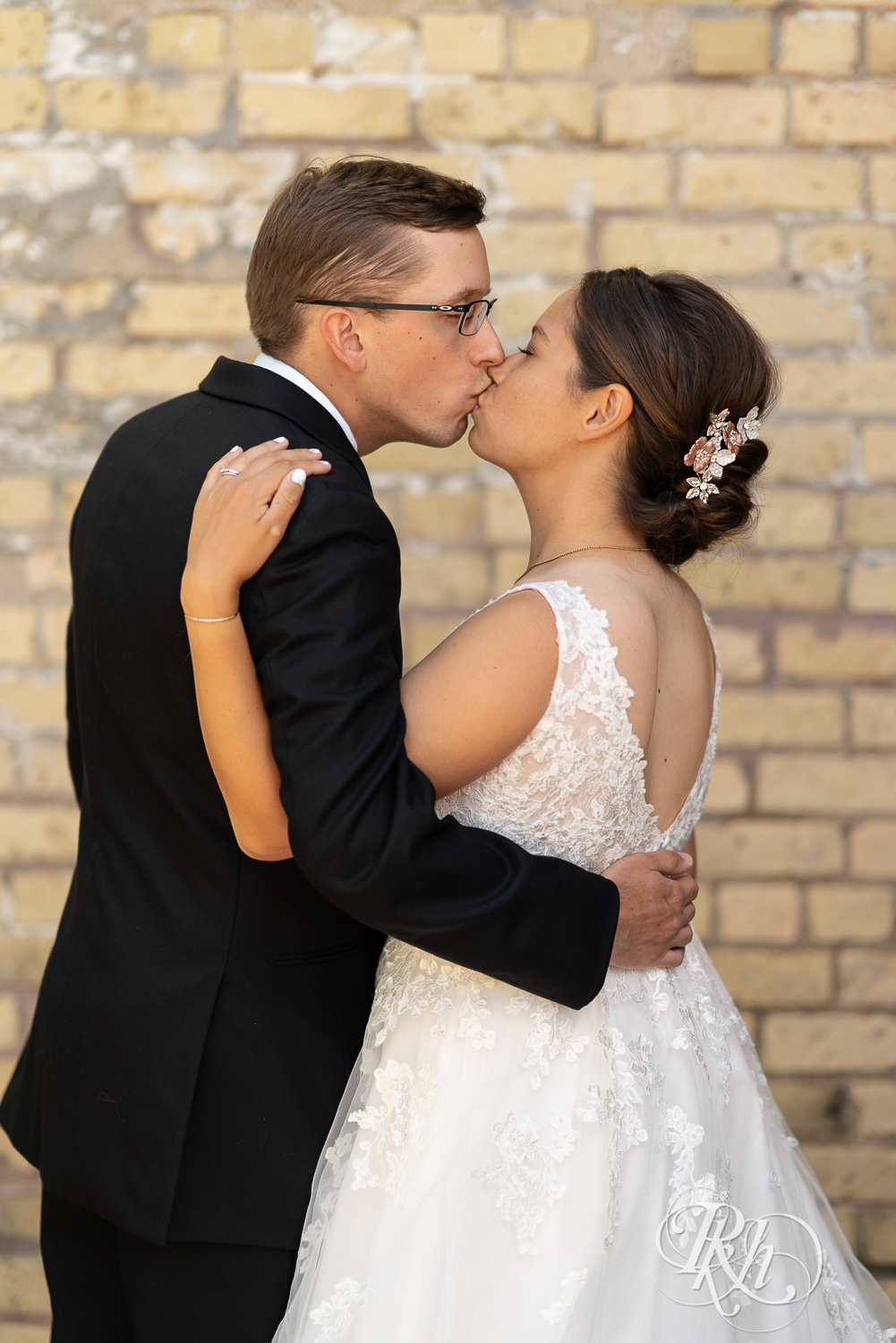 Bride and groom kiss at Kellerman's Event Center in White Bear Lake, Minnesota.