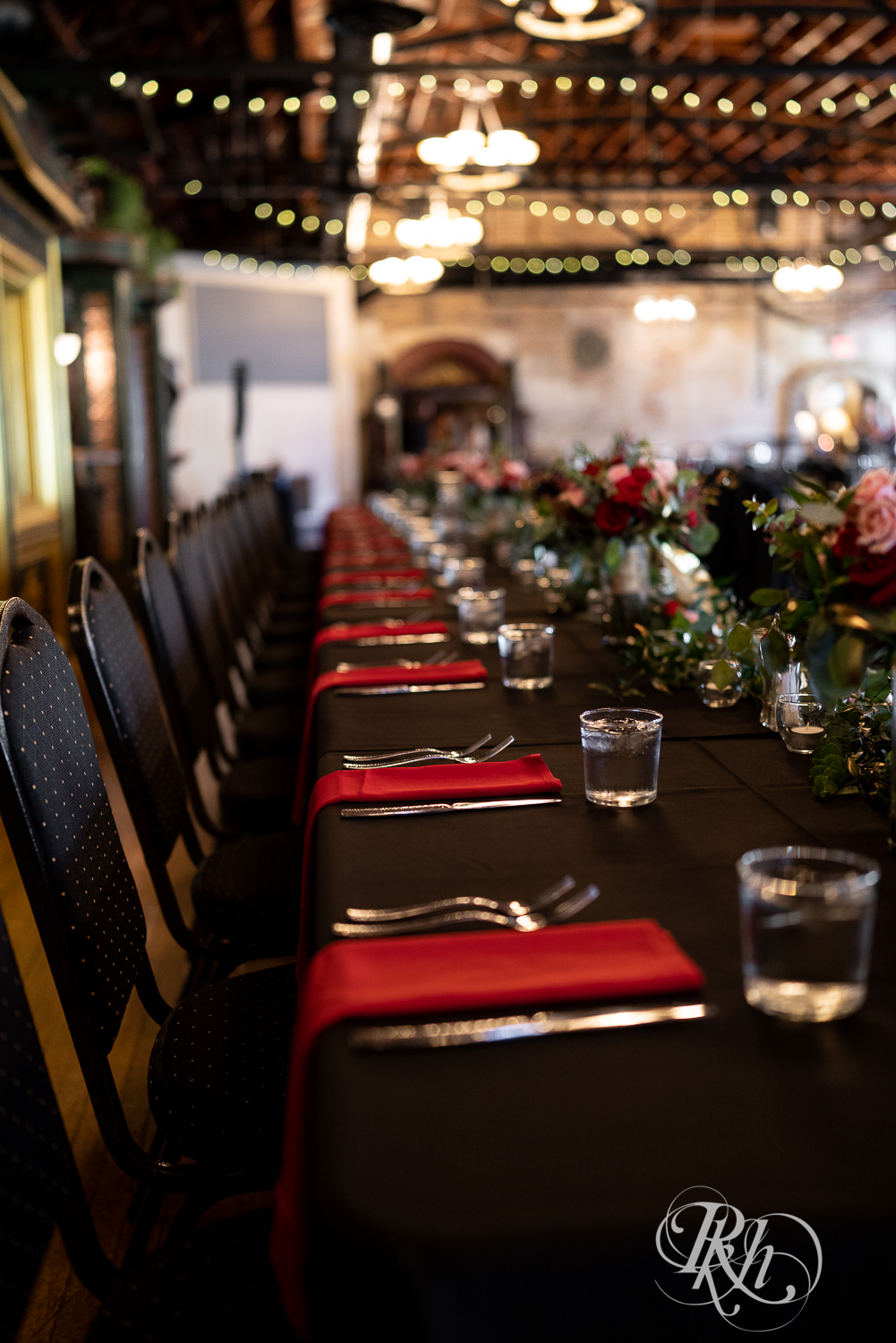 Indoor wedding reception black and red setup at Kellerman's Event Center in White Bear Lake, Minnesota.