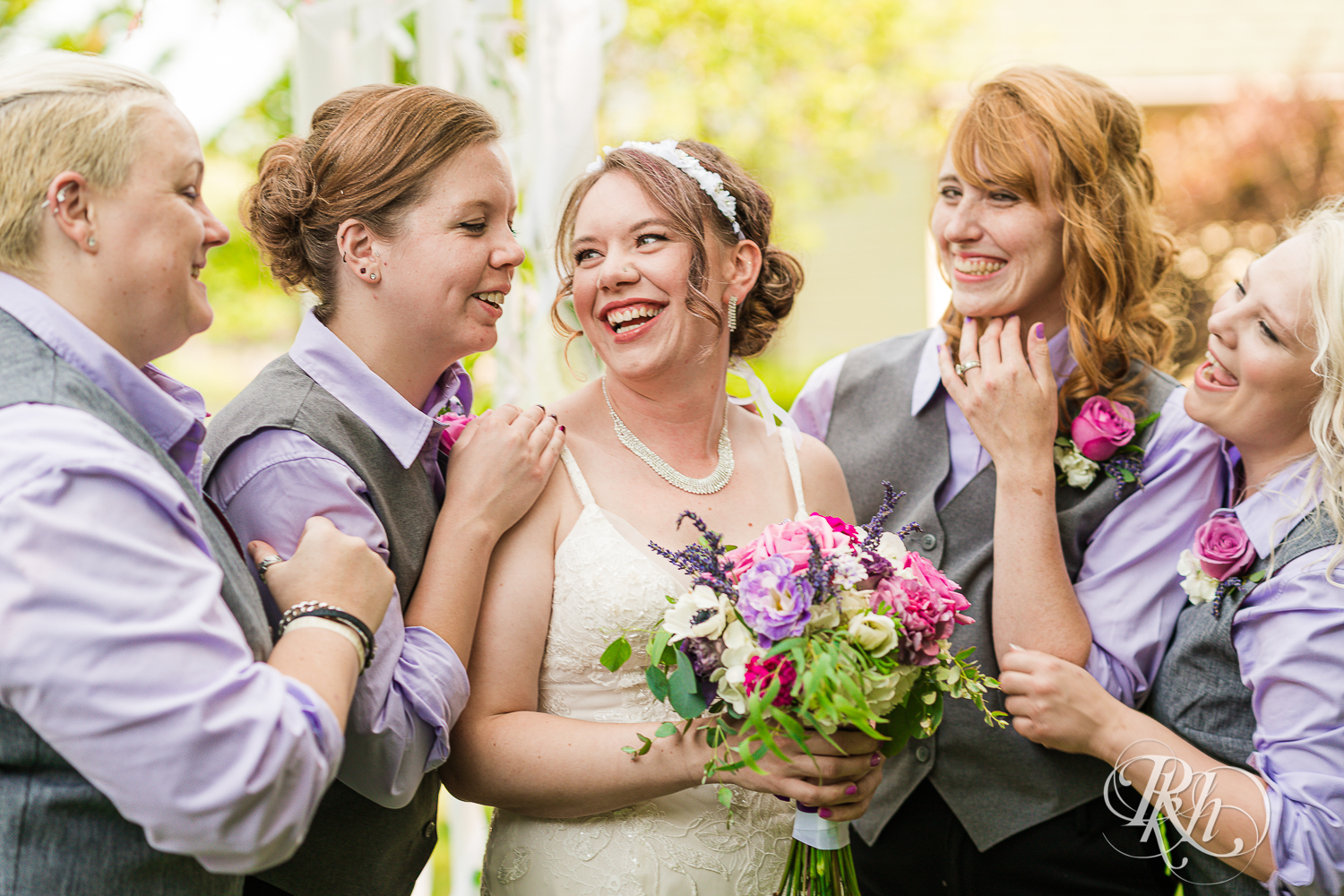 Lesbian wedding party smiling at wedding in Champlin, Minnesota.
