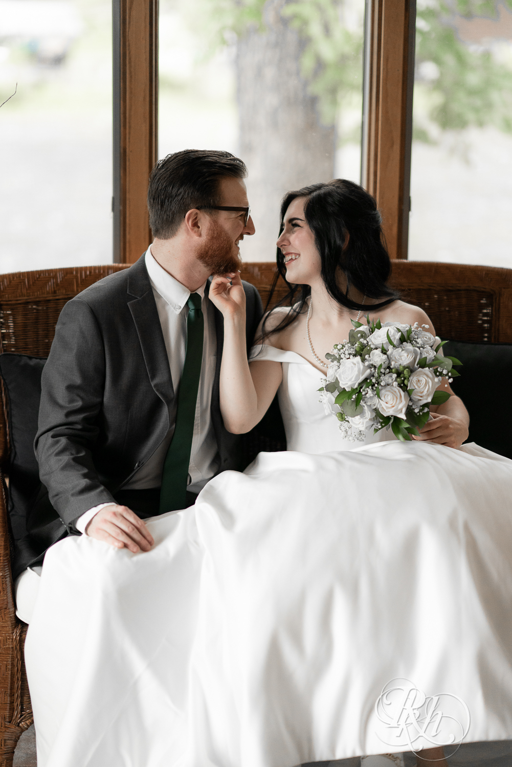 Bride and groom smile at their house wedding in Sartell, Minnesota.