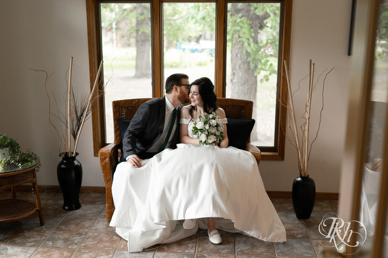 Bride and groom kiss at their house wedding in Sartell, Minnesota.