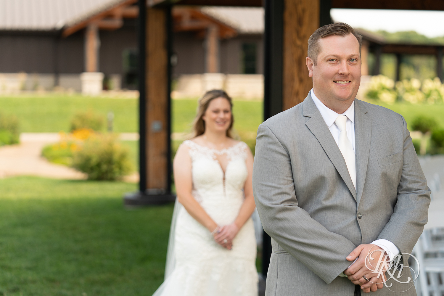 First look between bride and groom at summer wedding at 7 Vines Vineyard in Dellwood, Minnesota.
