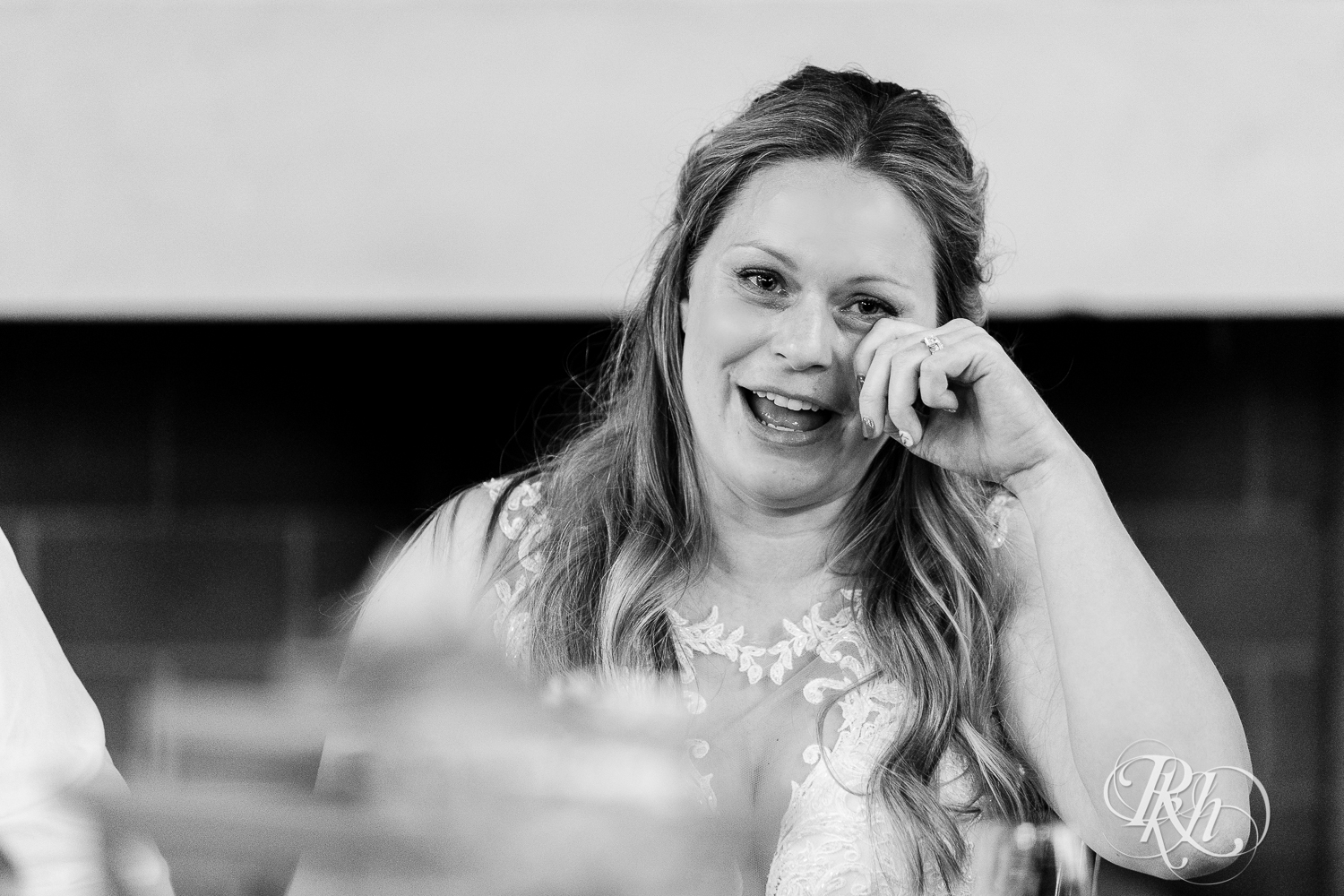 Bride crying during wedding reception at 7 Vines Vineyard in Dellwood, Minnesota.