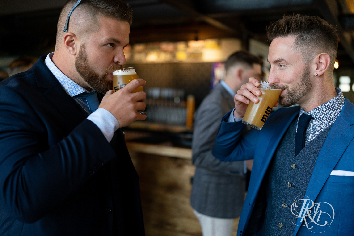 Gay grooms getting having drinks before wedding in Minneapolis, Minnesota.