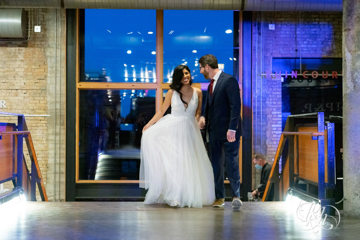 Bride and groom doing grand entrance at wedding reception in Mill City Museum in Minneapolis, Minnesota.