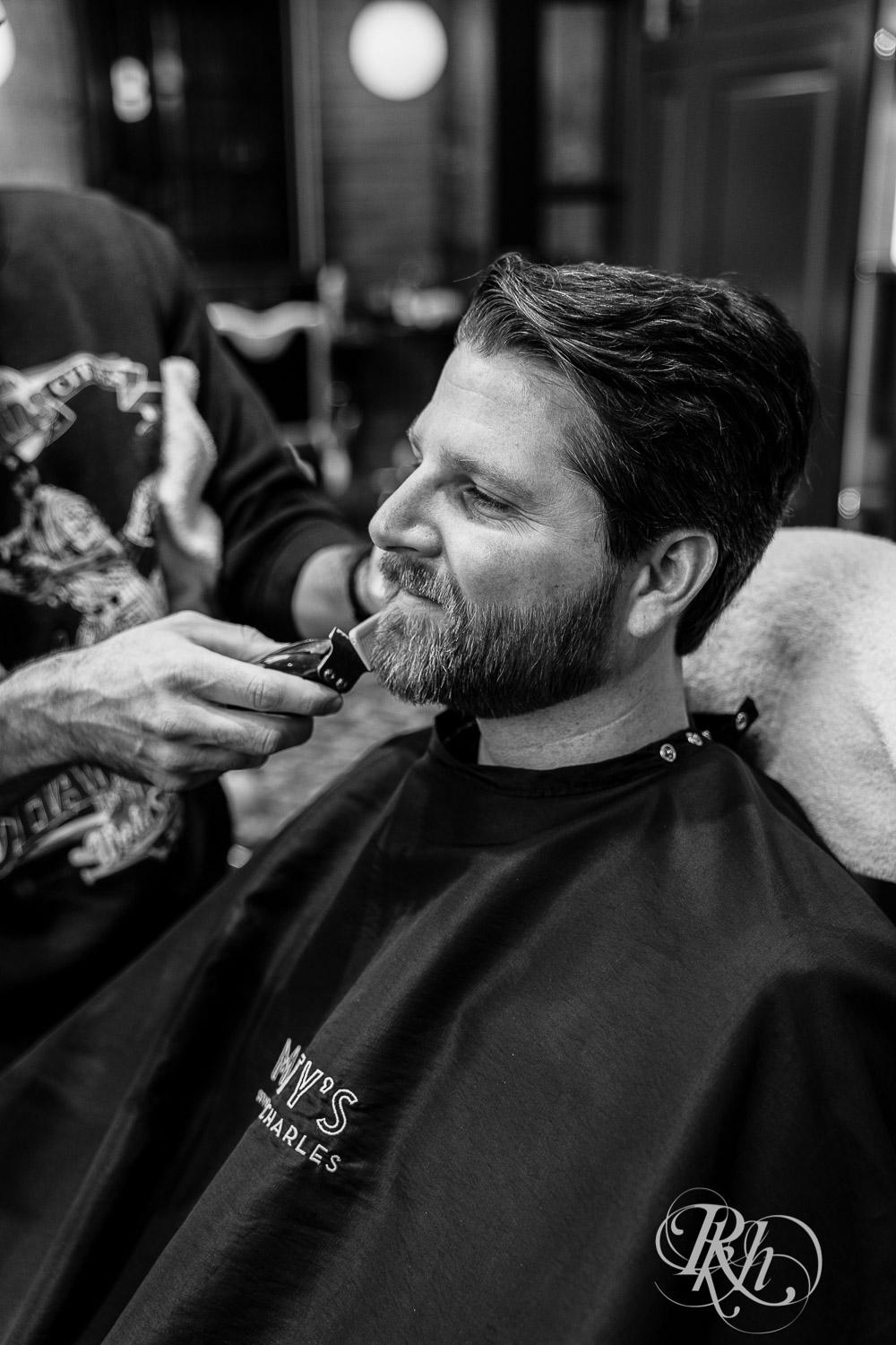 Groom getting a shave on wedding day.
