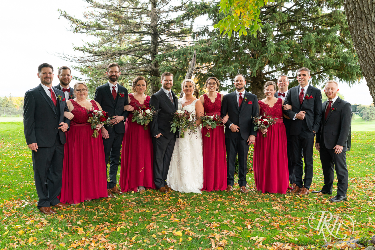 Wedding party in red dresses and gray suits at Hastings Golf Club in Hastings, Minnesota.