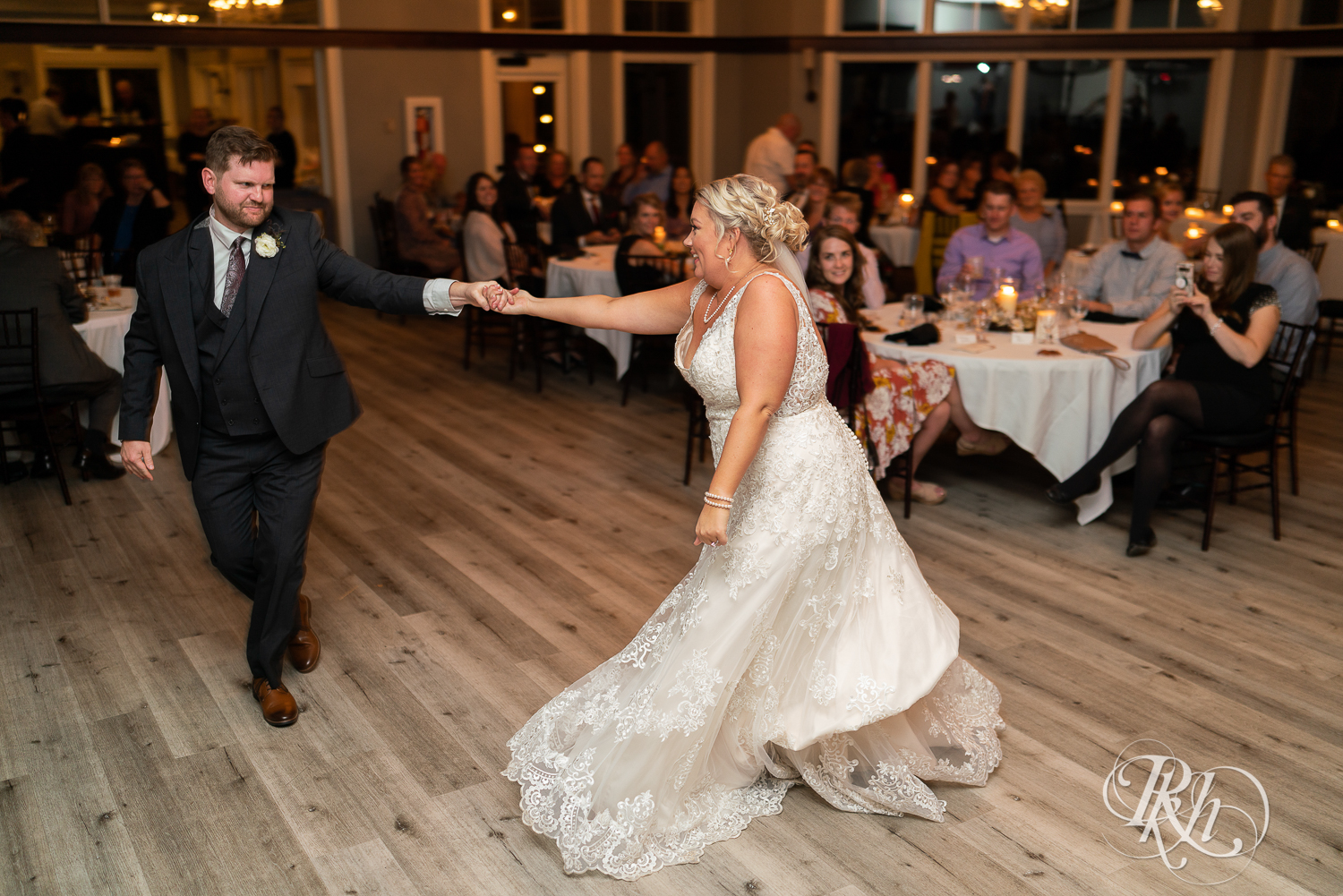 Bride and groom share first dance during wedding reception at Hastings Golf Club in Hastings, Minnesota.
