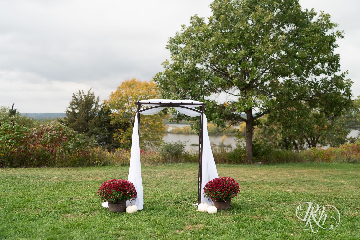 Outdoor fall wedding ceremony setup at Schaar's Bluff in Hastings, Minnesota. 