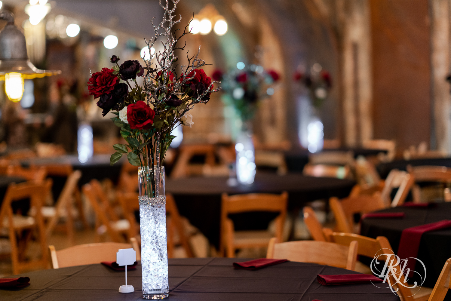Wedding reception with red roses setup at Warehouse Winery in Saint Louis Park, Minnesota.