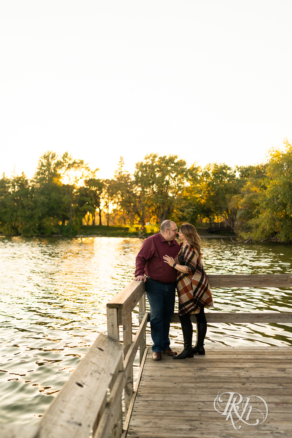Man and woman smiling at each other at Lake Nokomis in Minneapolis, Minnesota. 