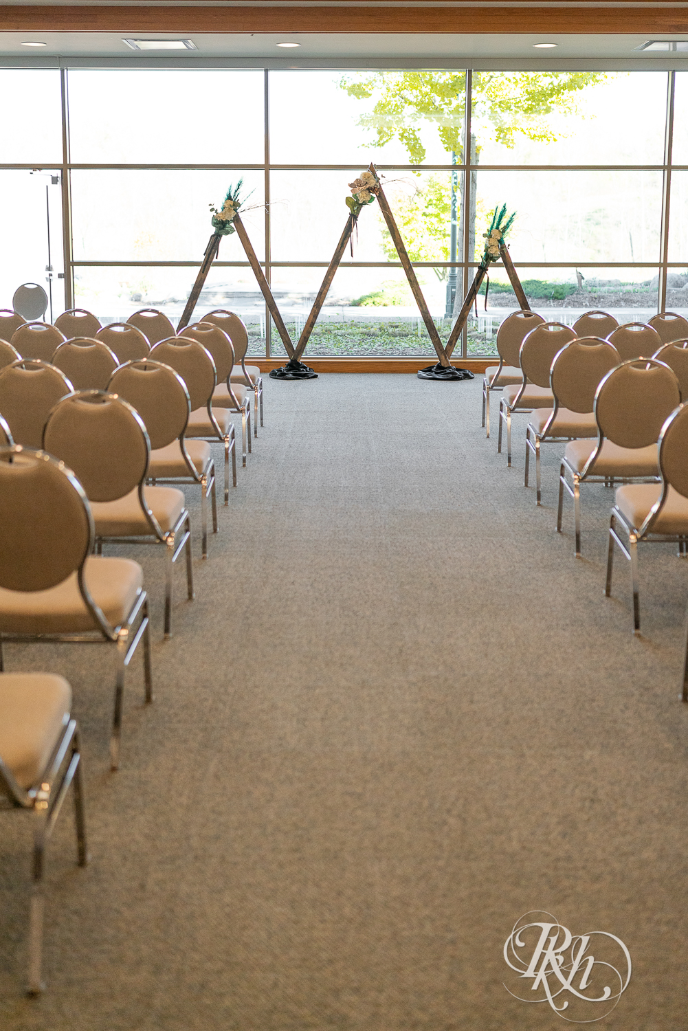 Indoor wedding ceremony setup at the Eagan Community Center in Eagan, Minnesota.