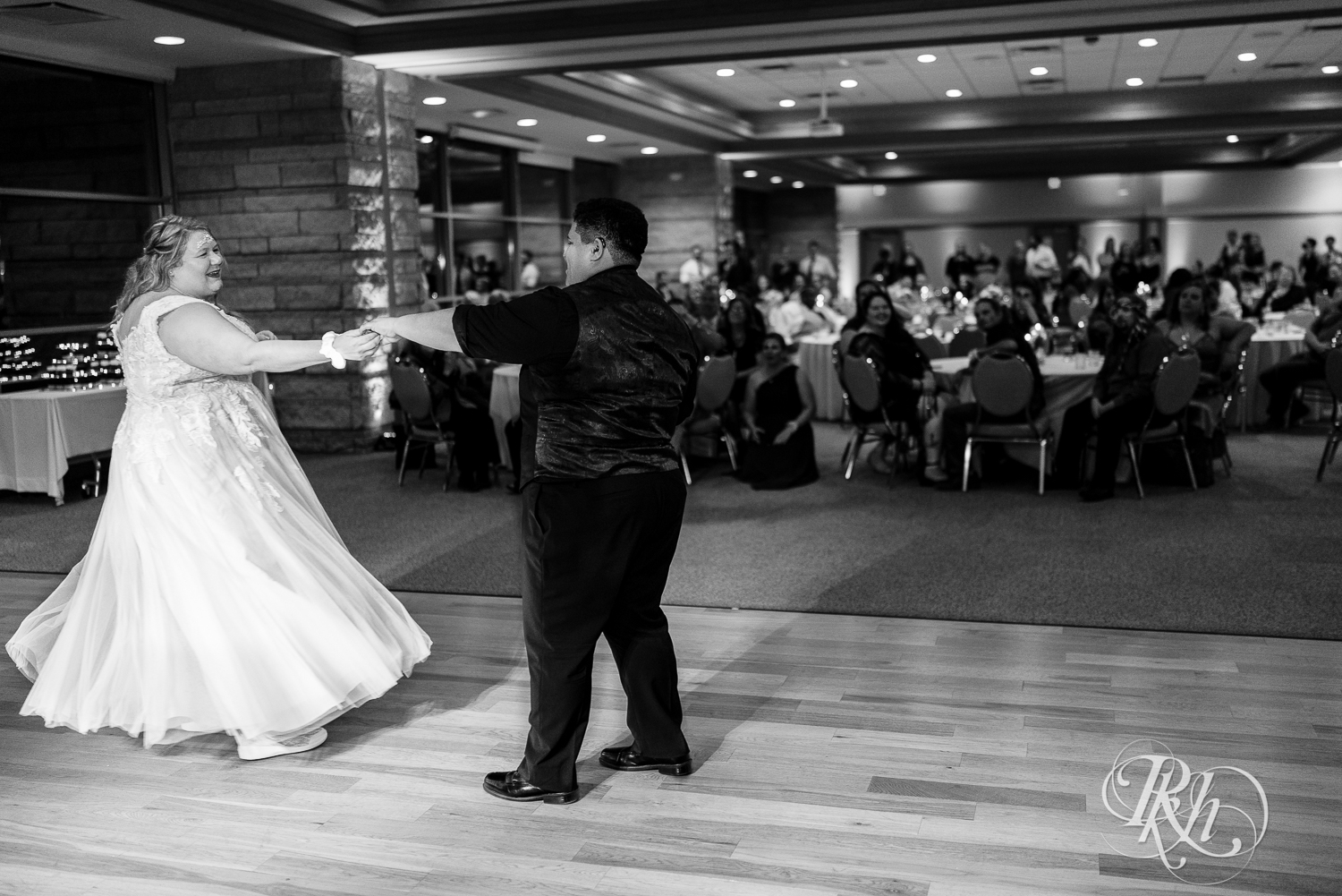Lesbian brides share first dance at wedding at Eagan Community Center in Eagan, Minnesota.
