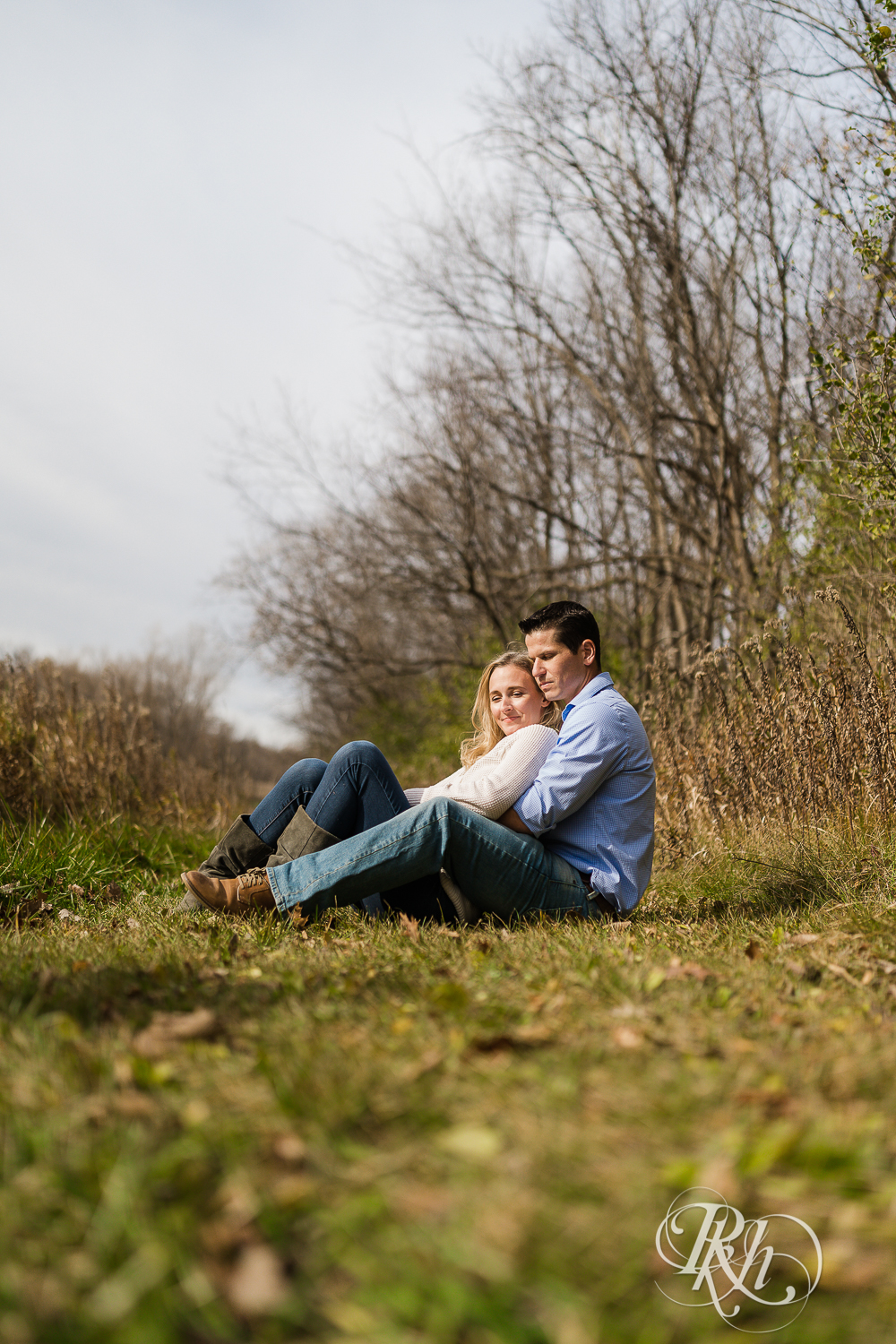 cozy engagement photography couple sitting in grass