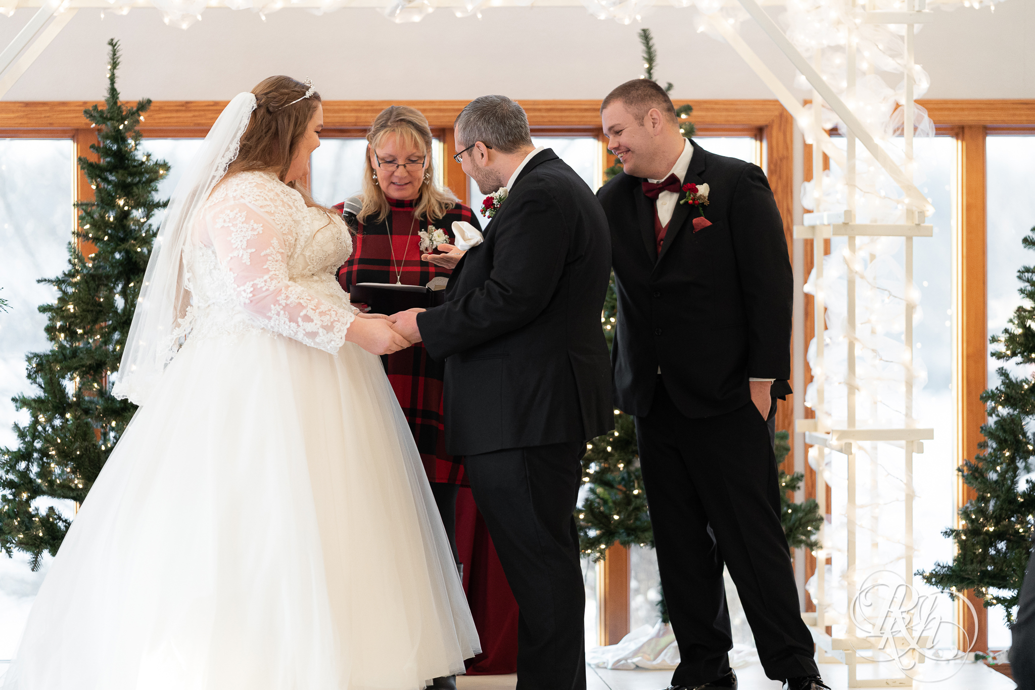 Wedding ceremony at Christmas wedding at Oak Glen Golf Course in Stillwater, Minnesota.
