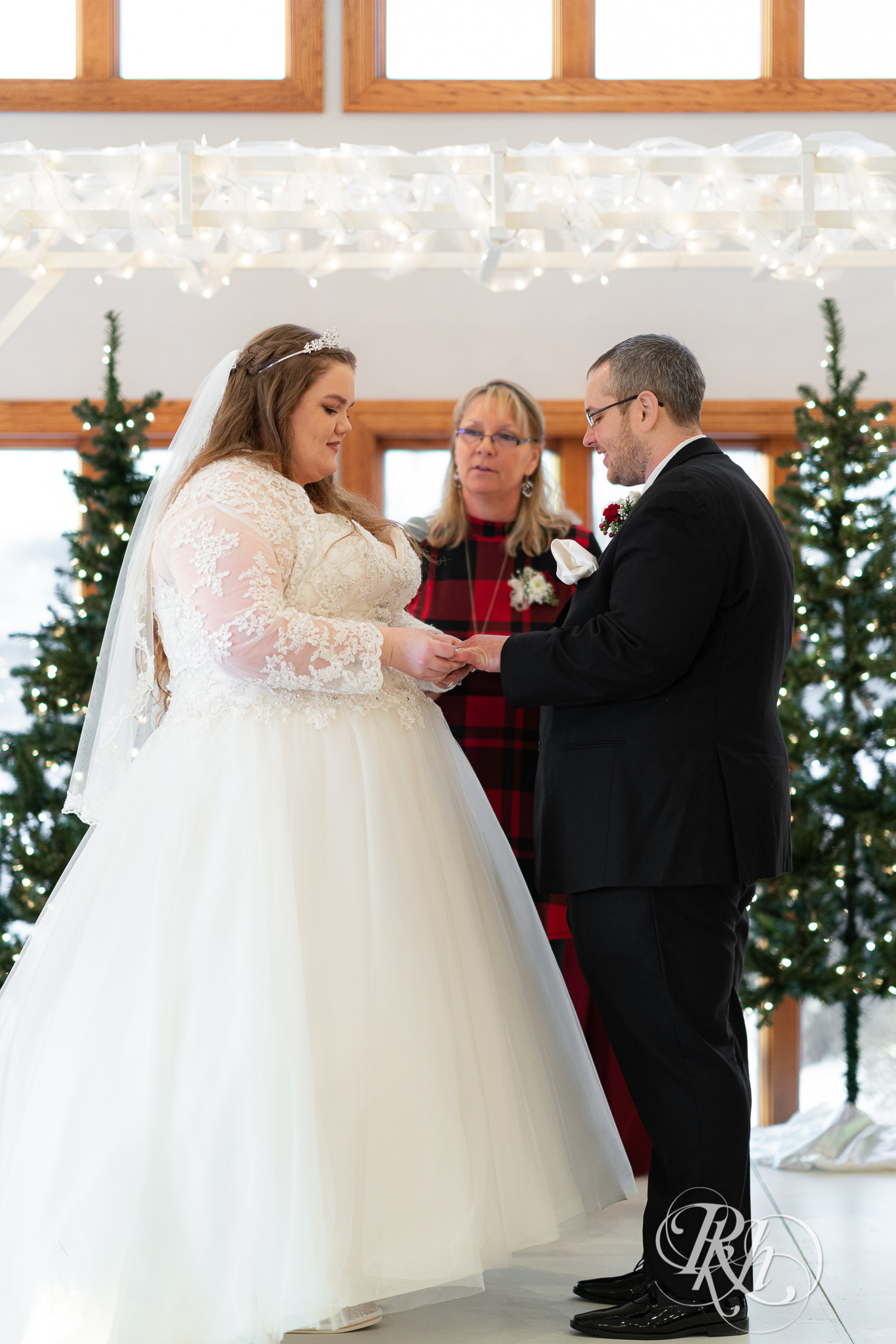 Wedding ceremony at Christmas wedding at Oak Glen Golf Course in Stillwater, Minnesota.