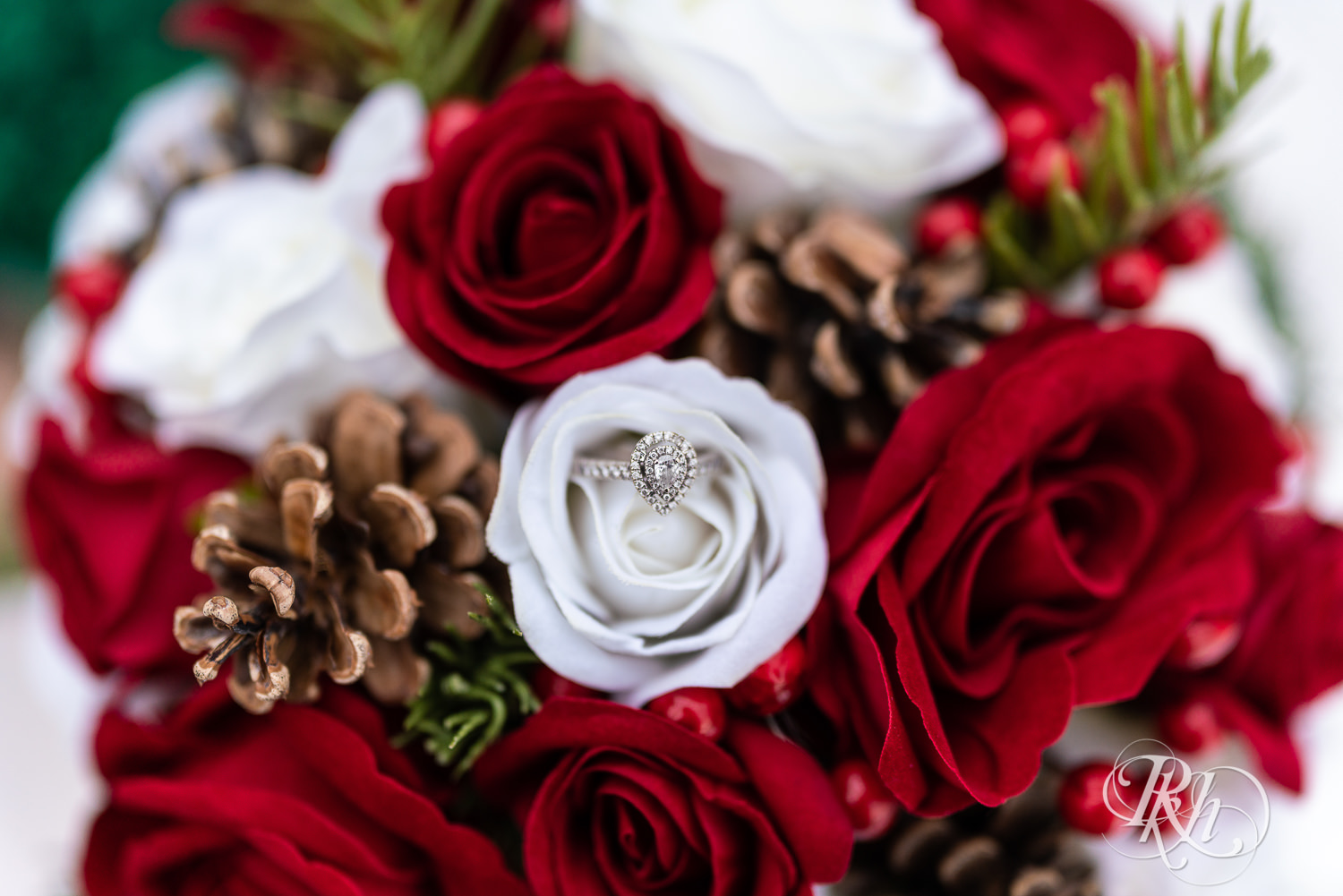 Wedding ring in pine cones and roses at Grand Superior Lodge in Two Harbors, Minnesota.