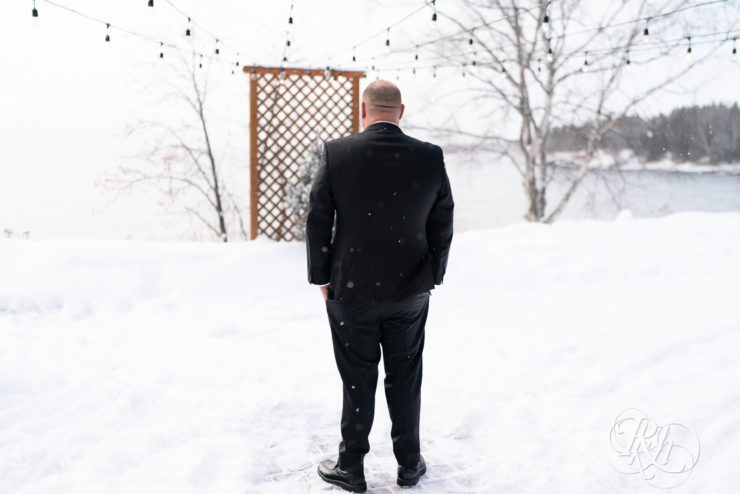 First look between bride and groom in the snow at Grand Superior Lodge in Two Harbors, Minnesota.