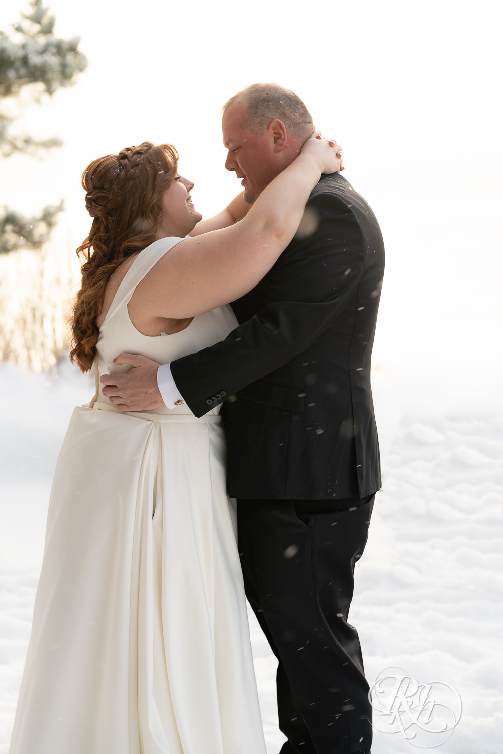 First look between bride and groom in the snow at Grand Superior Lodge in Two Harbors, Minnesota.