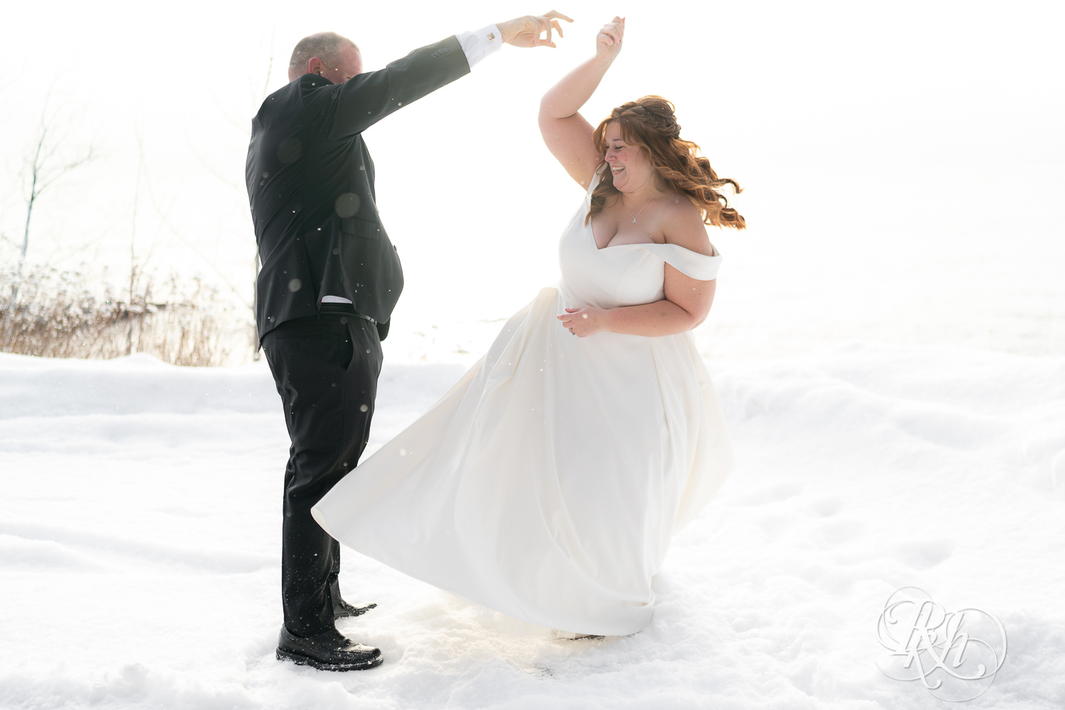 Bride and groom dancing in the snow at Grand Superior Lodge in Two Harbors, Minnesota.