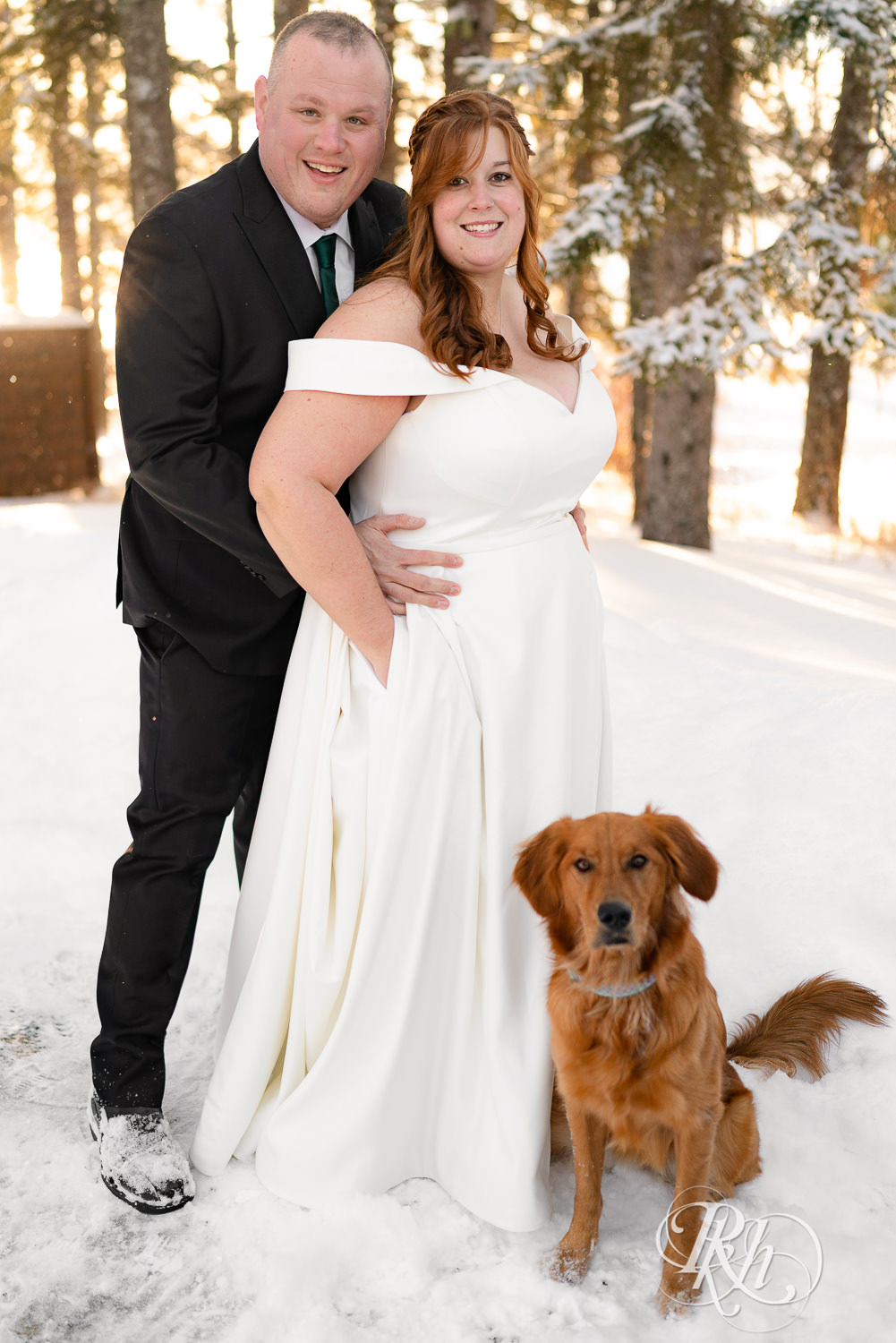 Bride and groom with their Golden Retriever at Grand Superior Lodge in Two Harbors, Minnesota.