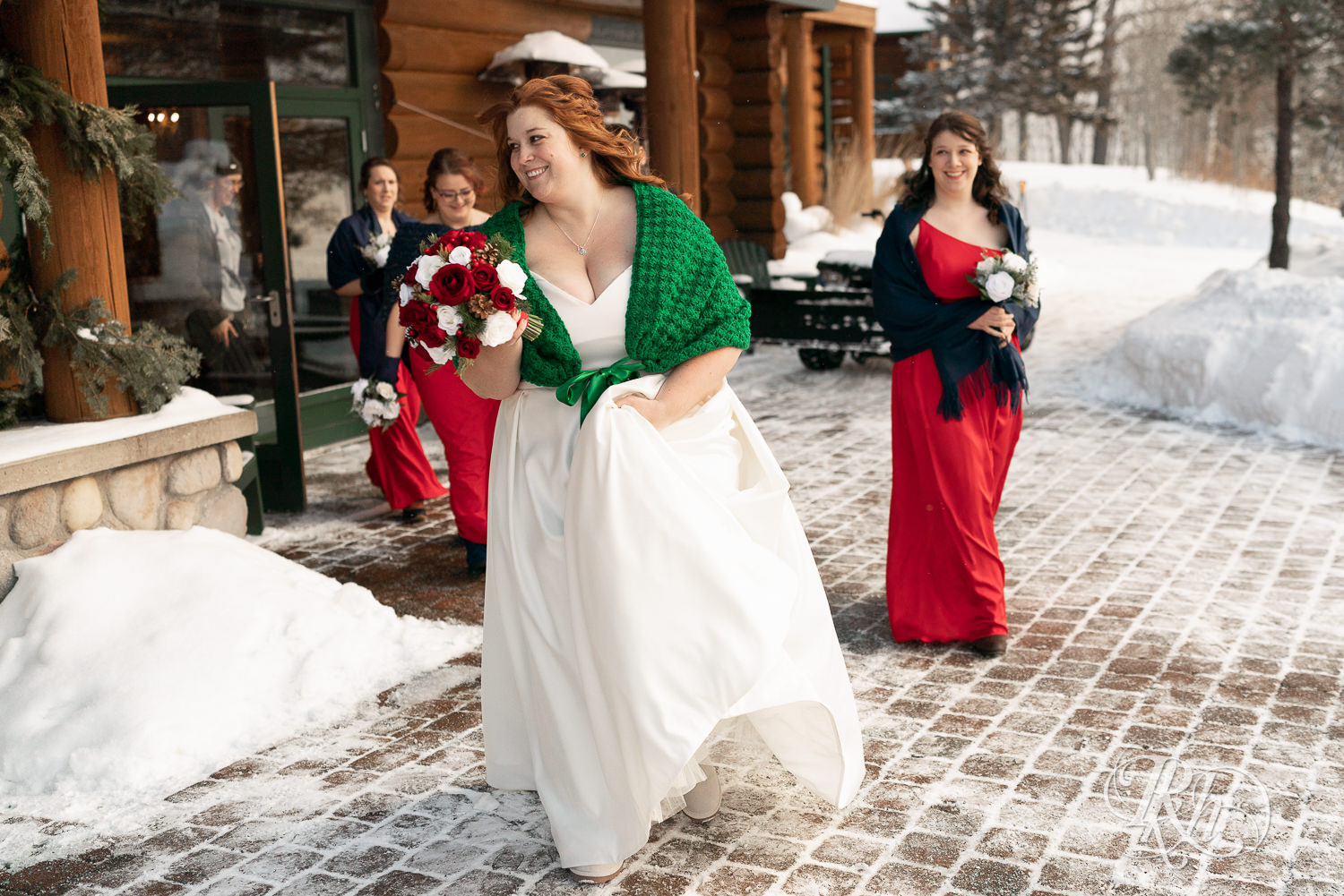 Winter wedding party  in the snow at Grand Superior Lodge in Two Harbors, Minnesota.