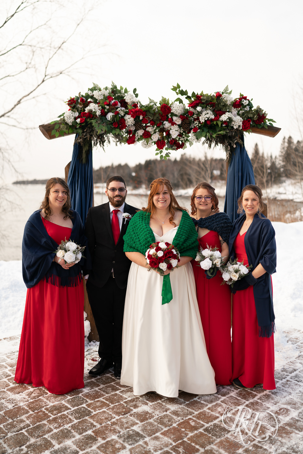 Winter wedding party in the snow at Grand Superior Lodge in Two Harbors, Minnesota.