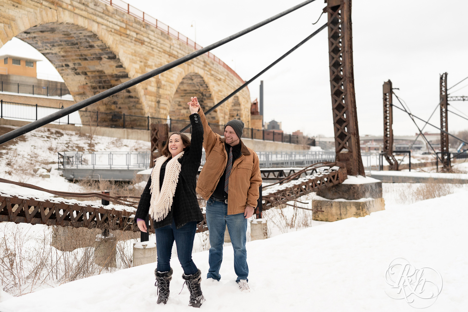 Man and woman dancing in snow at Mill City Ruins in Minneapolis, Minnesota.