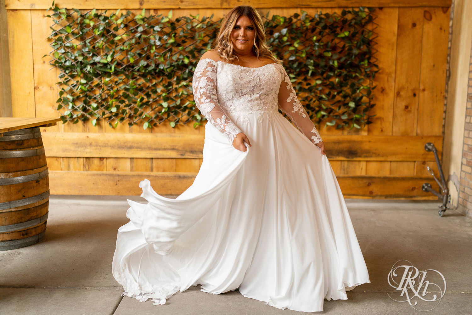 Plus size bride smiling in wedding dresses in Minneapolis, Minnesota.