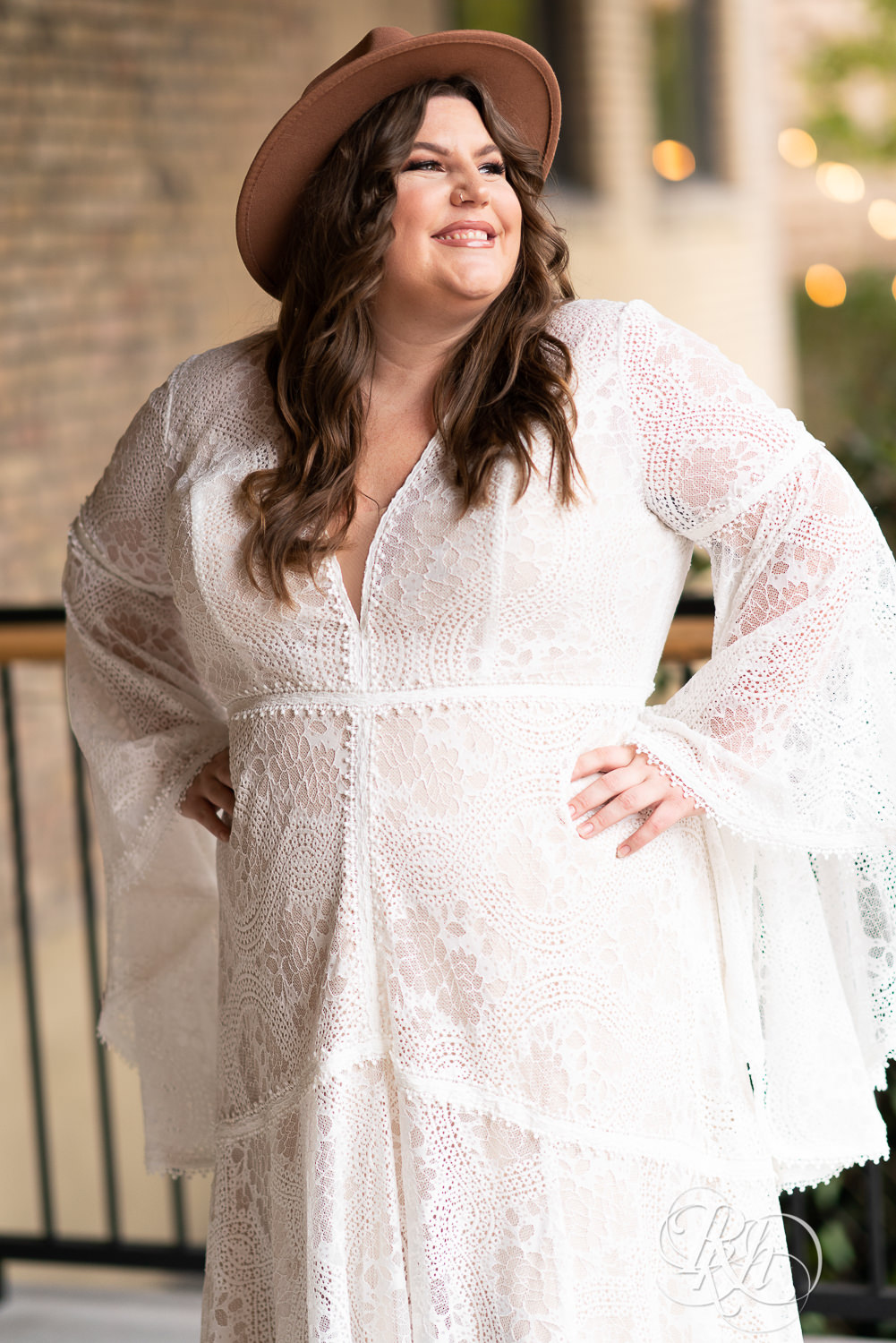 Plus size bride smiling in wedding dresses in Minneapolis, Minnesota.
