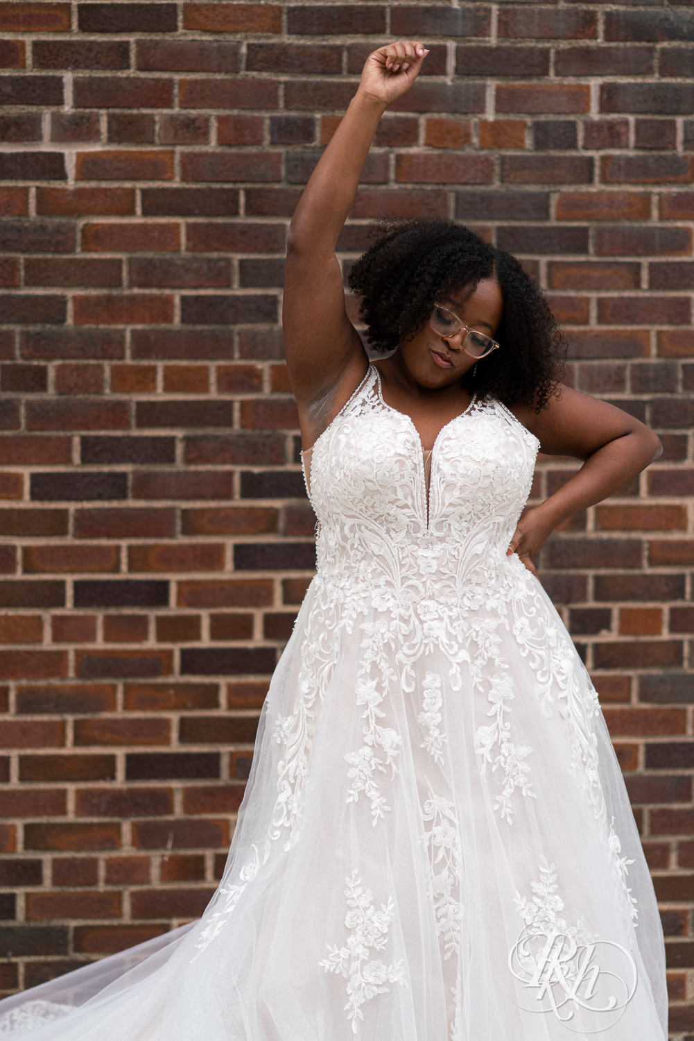 Black plus size bride smiling in wedding dress in Minneapolis, Minnesota.