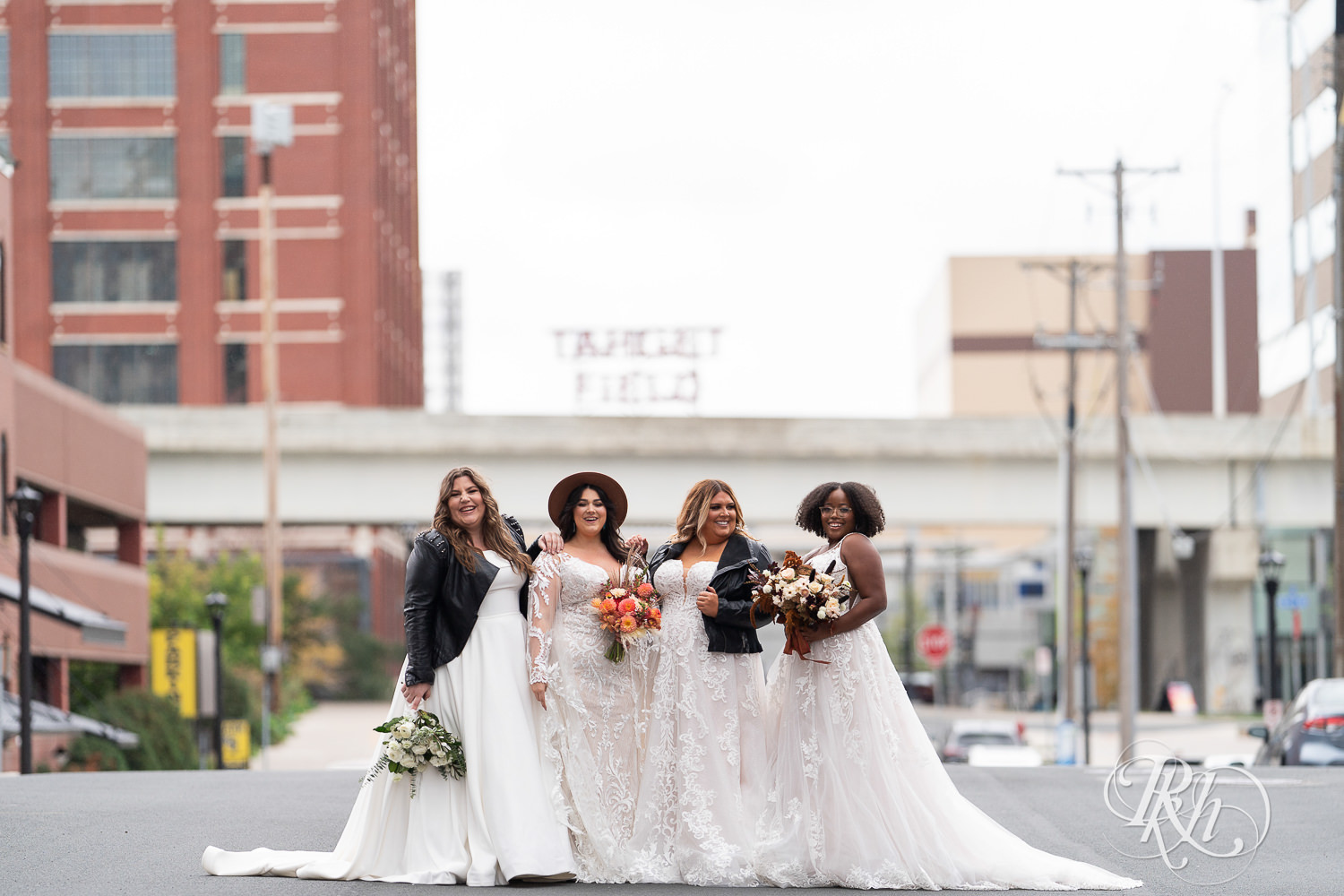 Plus size brides smiling in wedding dresses in Minneapolis, Minnesota.