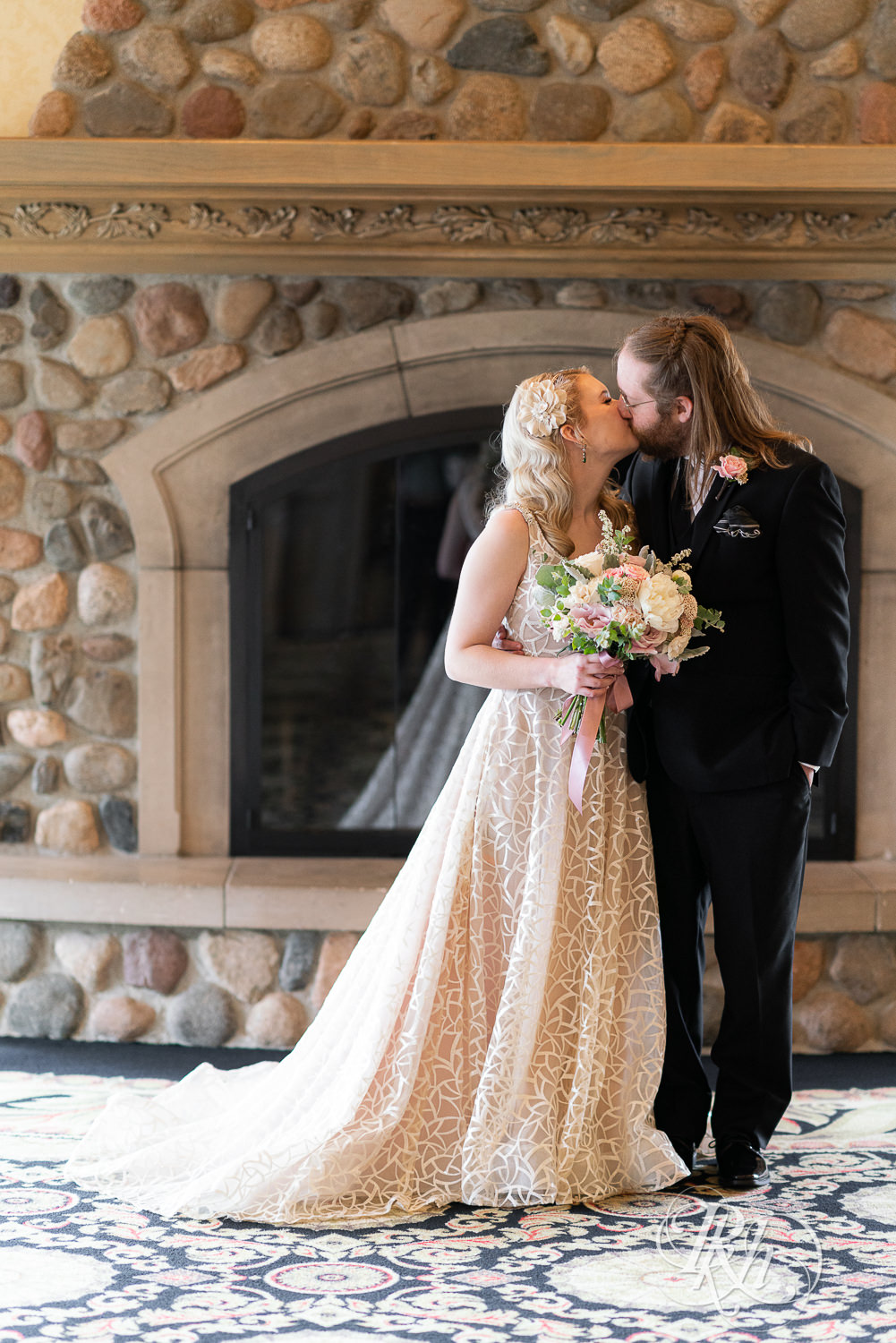 Bride and groom kiss at Rush Creek Golf Club in Maple Grove, Minnesota.