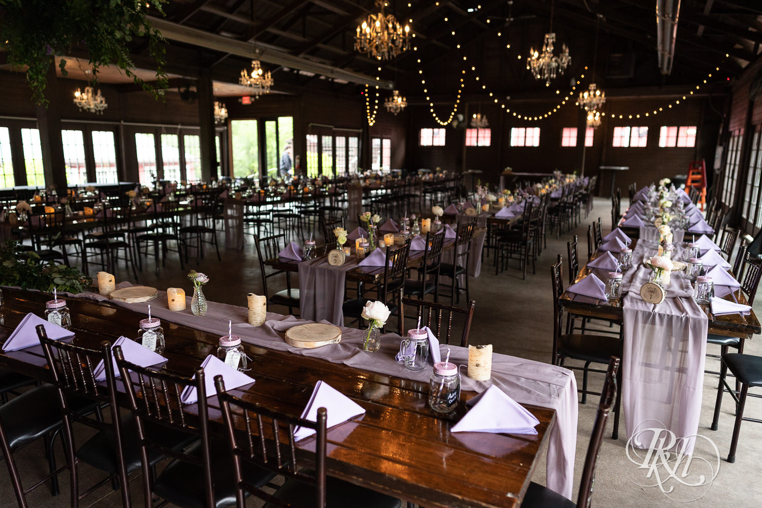 Indoor reception setup with purple accents at Hope Glen Farm in Cottage Grove, Minnesota.