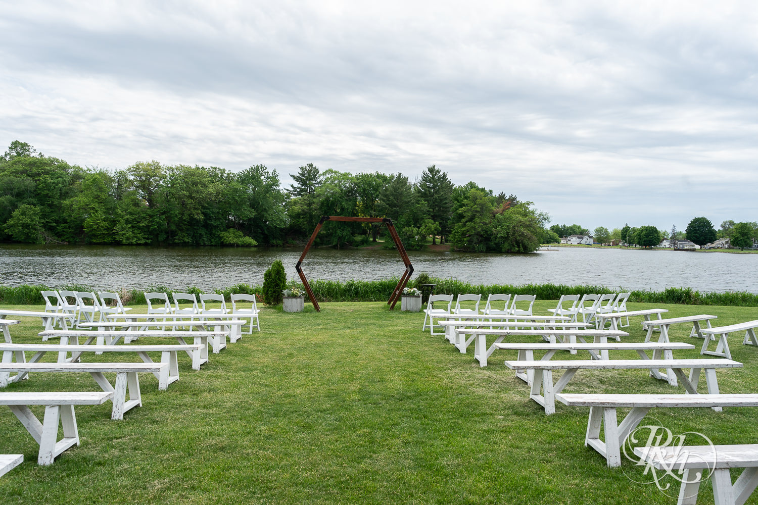 Lakefront wedding ceremony setup at Barn at Mirror Lake in Mondovi, Wisconsin.