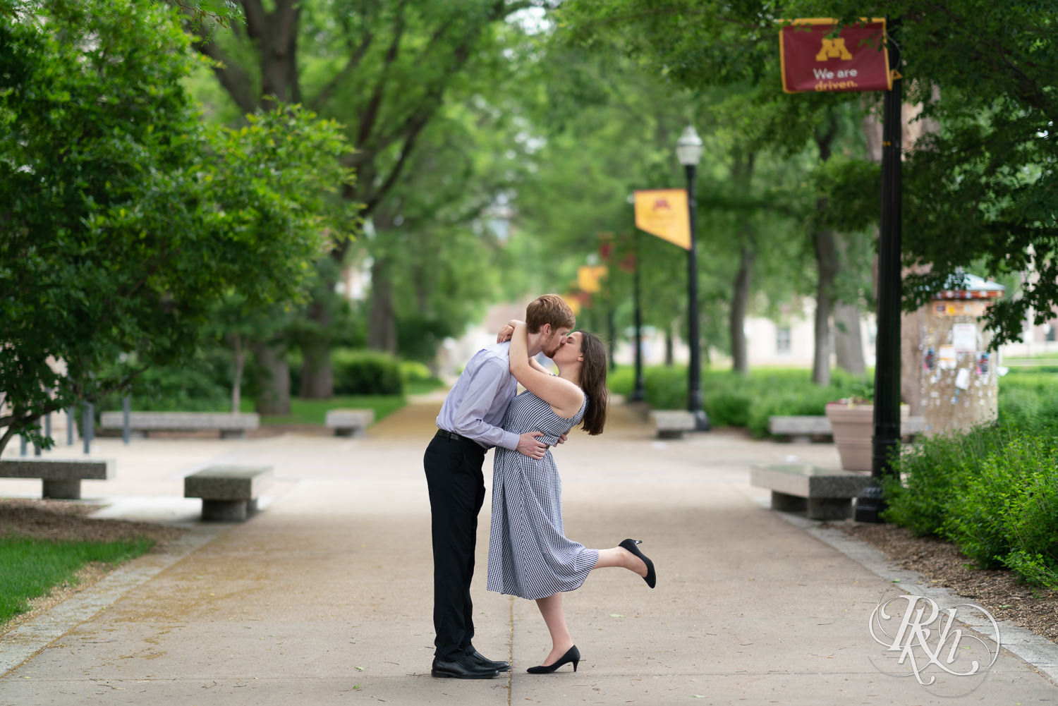 Man and woman kissing during engagement session at University of Minnesota.
