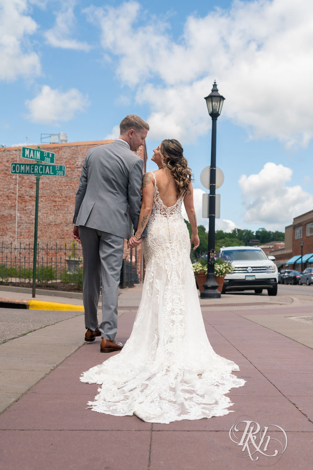 Bride and groom crossing street in Stillwater, Minnesota.