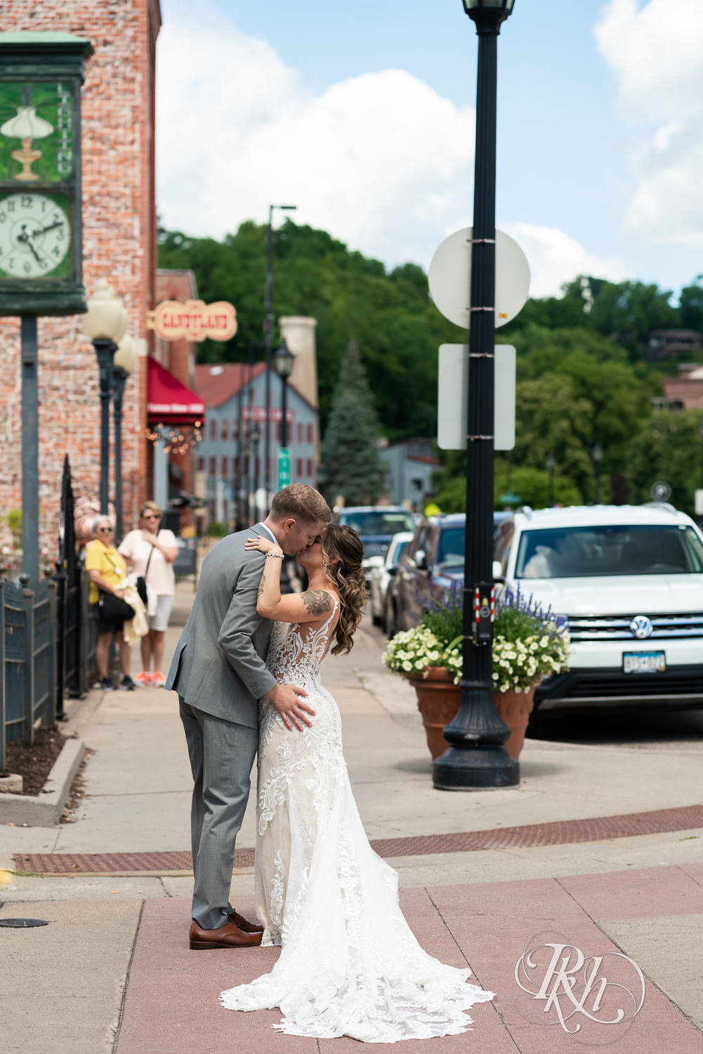 Bride and groom kissing in street in Stillwater, Minnesota.